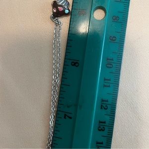 Costume jewelry 3 necklaces , 2 bracelets & 1 pair of earrings all silver tone.